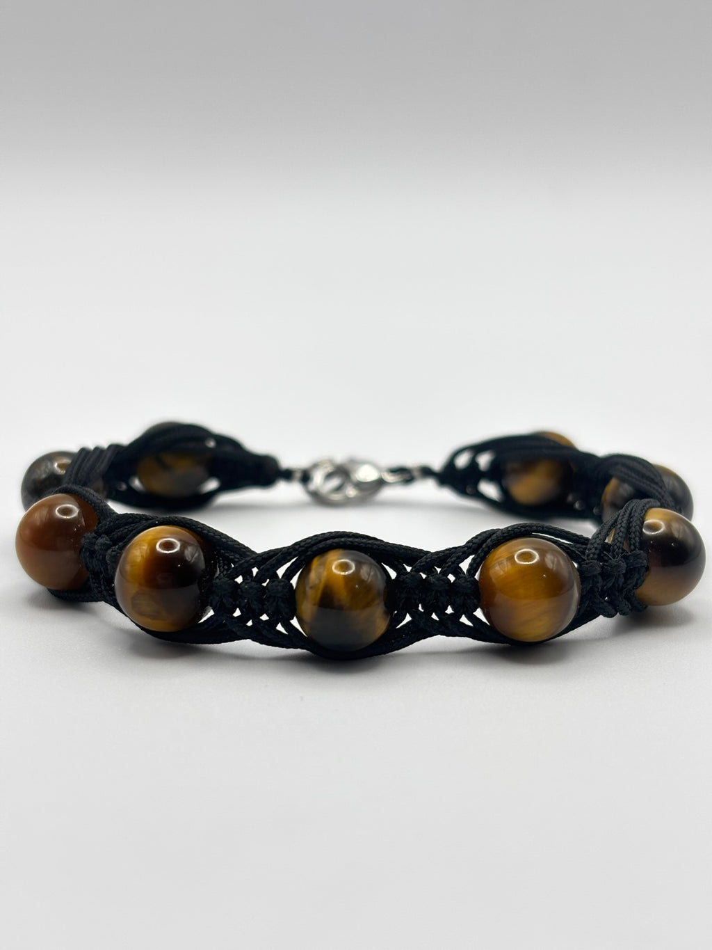 Pulsera de Ojo de Tigre con Tejido Trezado– Protección, Confianza y Fuerza Interior