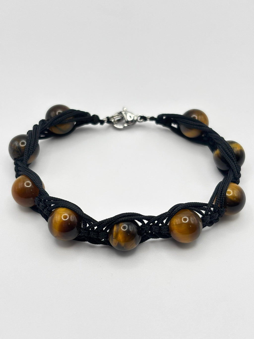 Pulsera de Ojo de Tigre con Tejido Trezado– Protección, Confianza y Fuerza Interior