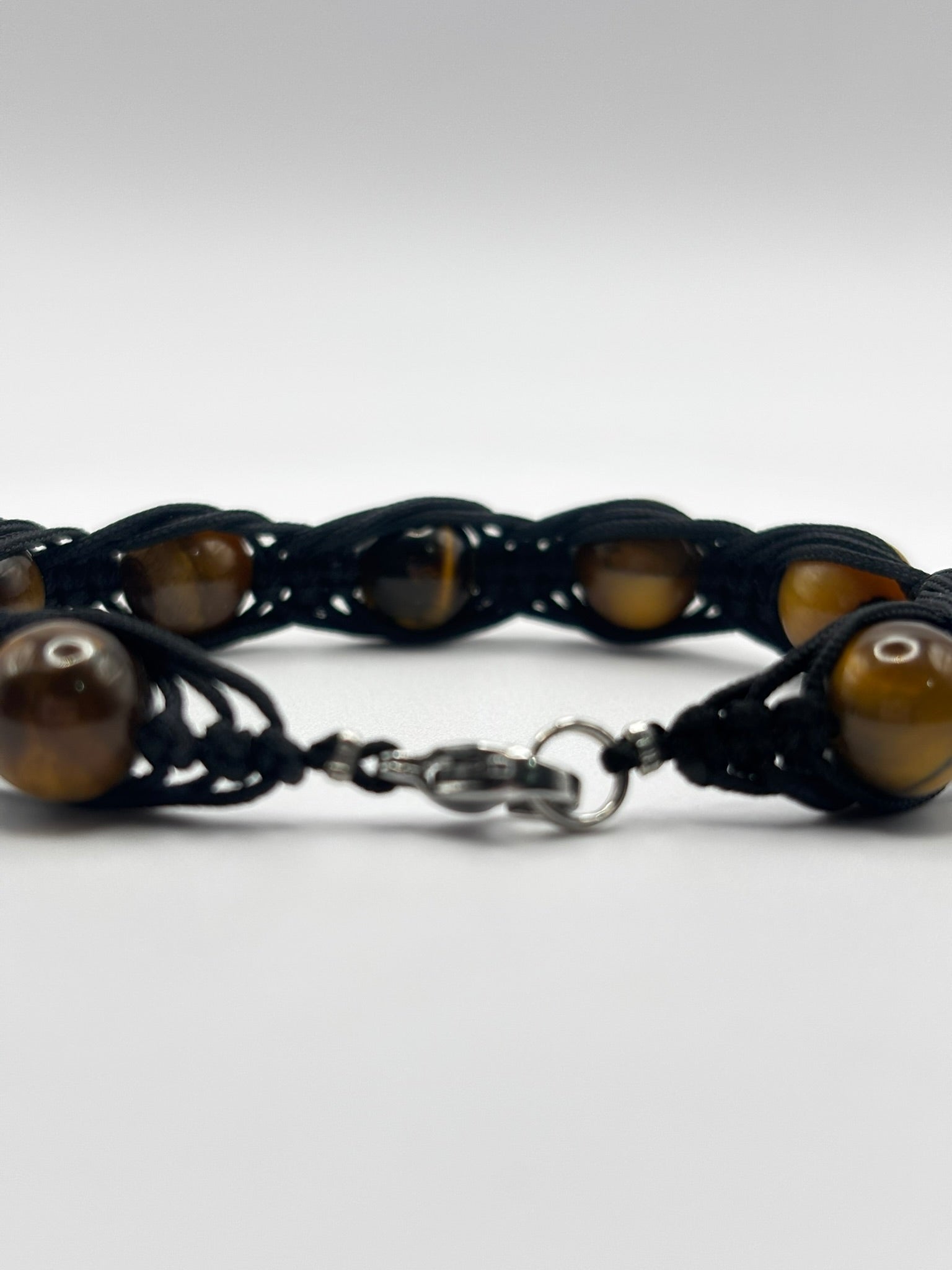 Pulsera de Ojo de Tigre con Tejido Trezado– Protección, Confianza y Fuerza Interior