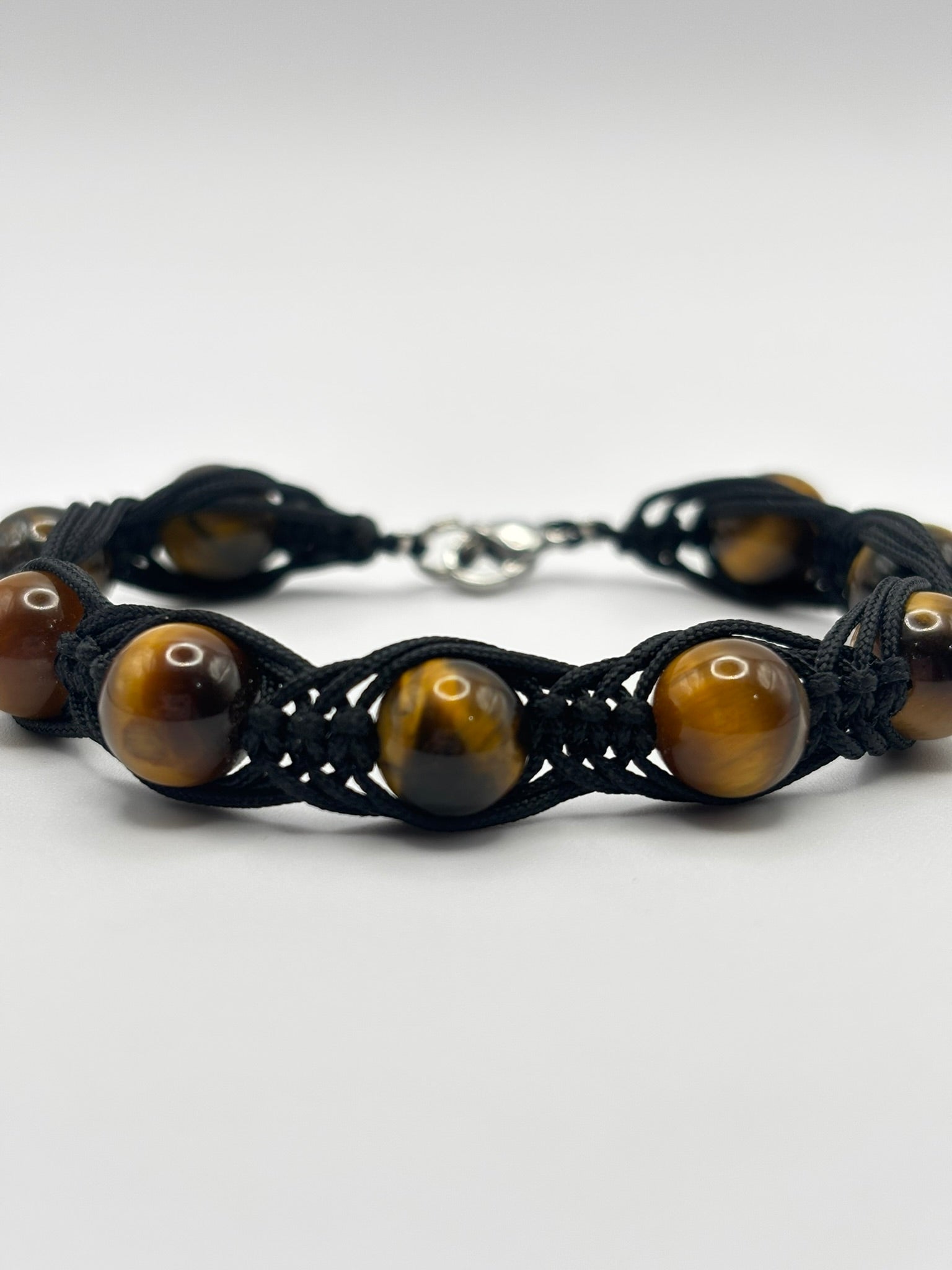 Pulsera de Ojo de Tigre con Tejido Trezado– Protección, Confianza y Fuerza Interior